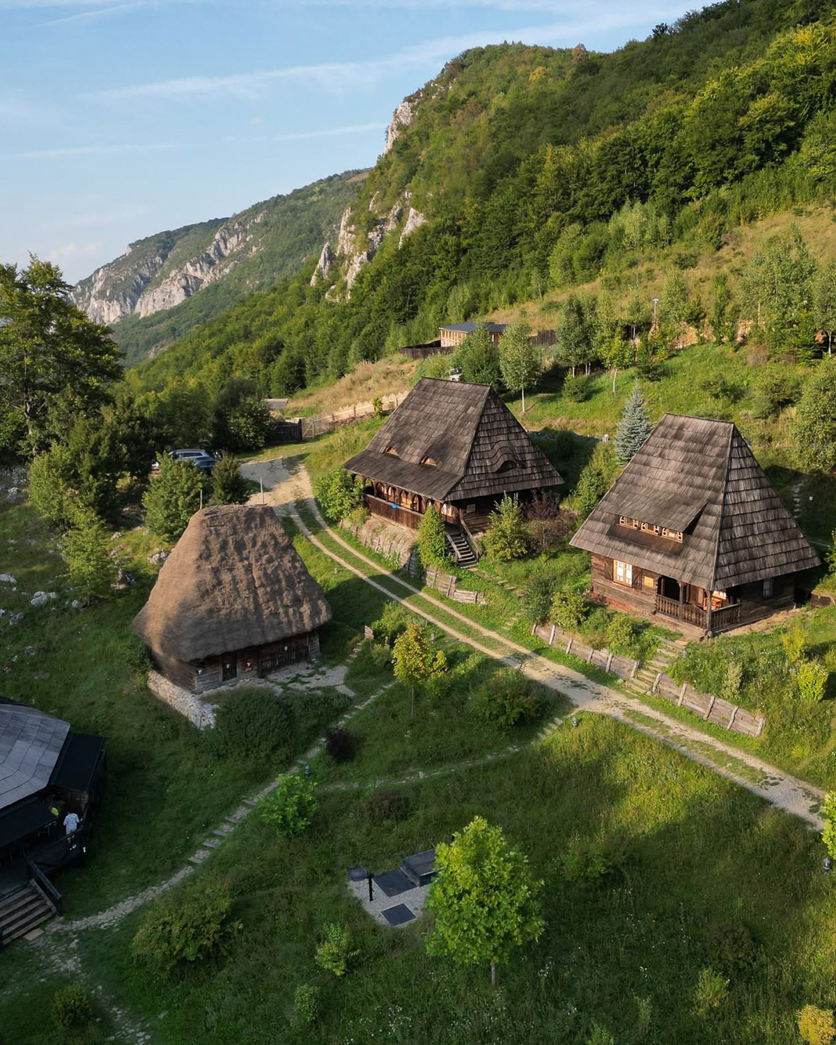 Traditional wooden cottages at Raven's Nest in the Apuseni Mountains