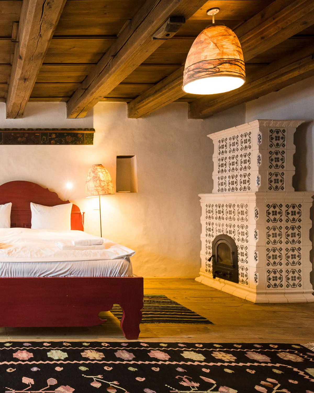 Guest room with traditional ceramic stove at Viscri 125