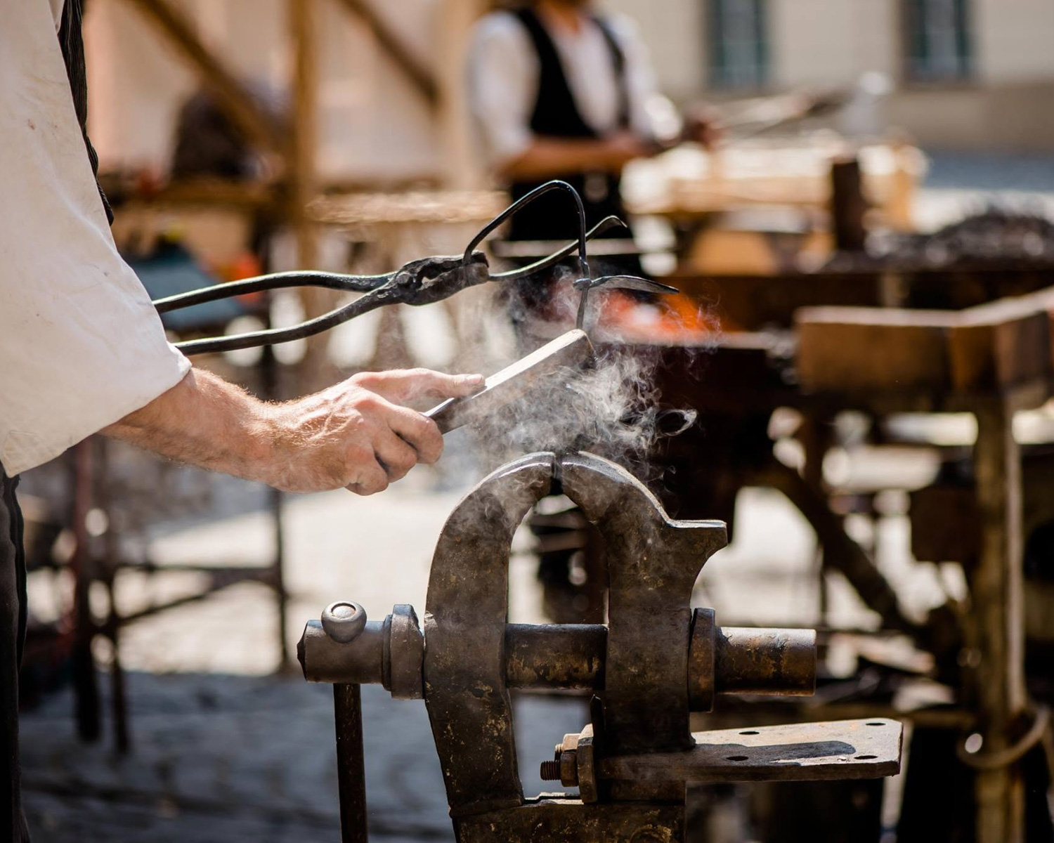 Artisan blacksmith working with traditional metalworking tool
