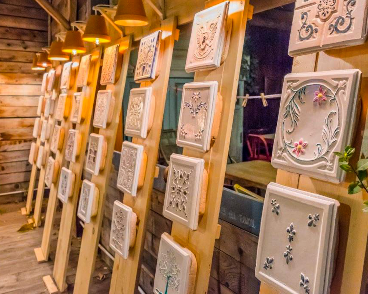 Handcrafted ceramic stove tiles in a traditional artisan workshop