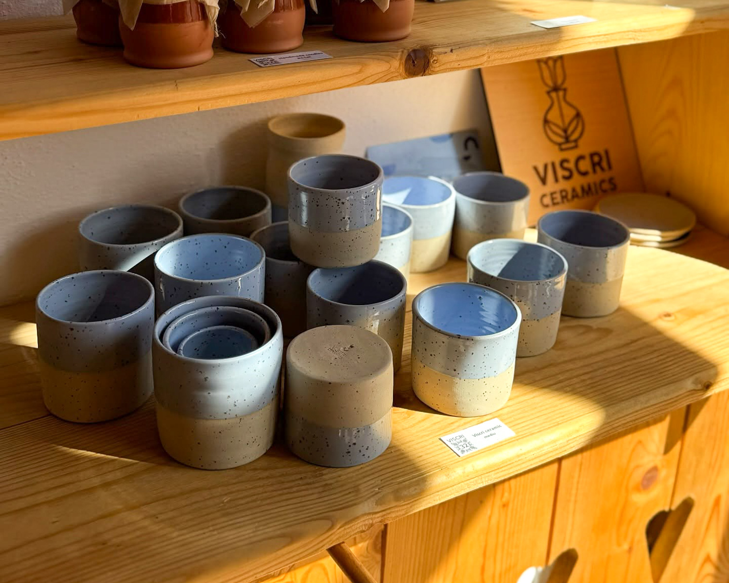 Handmade ceramic cups displayed in Viscri